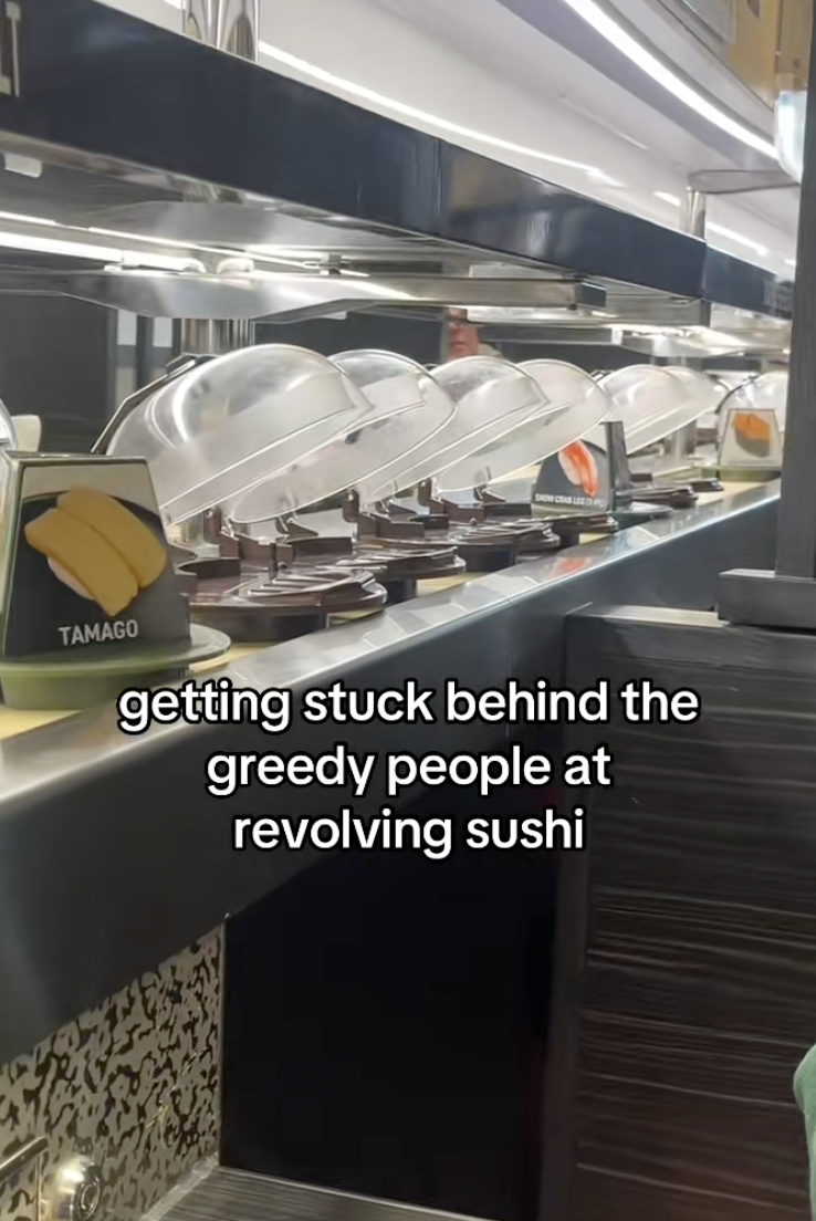 sushi conveyer belt in a restaurant